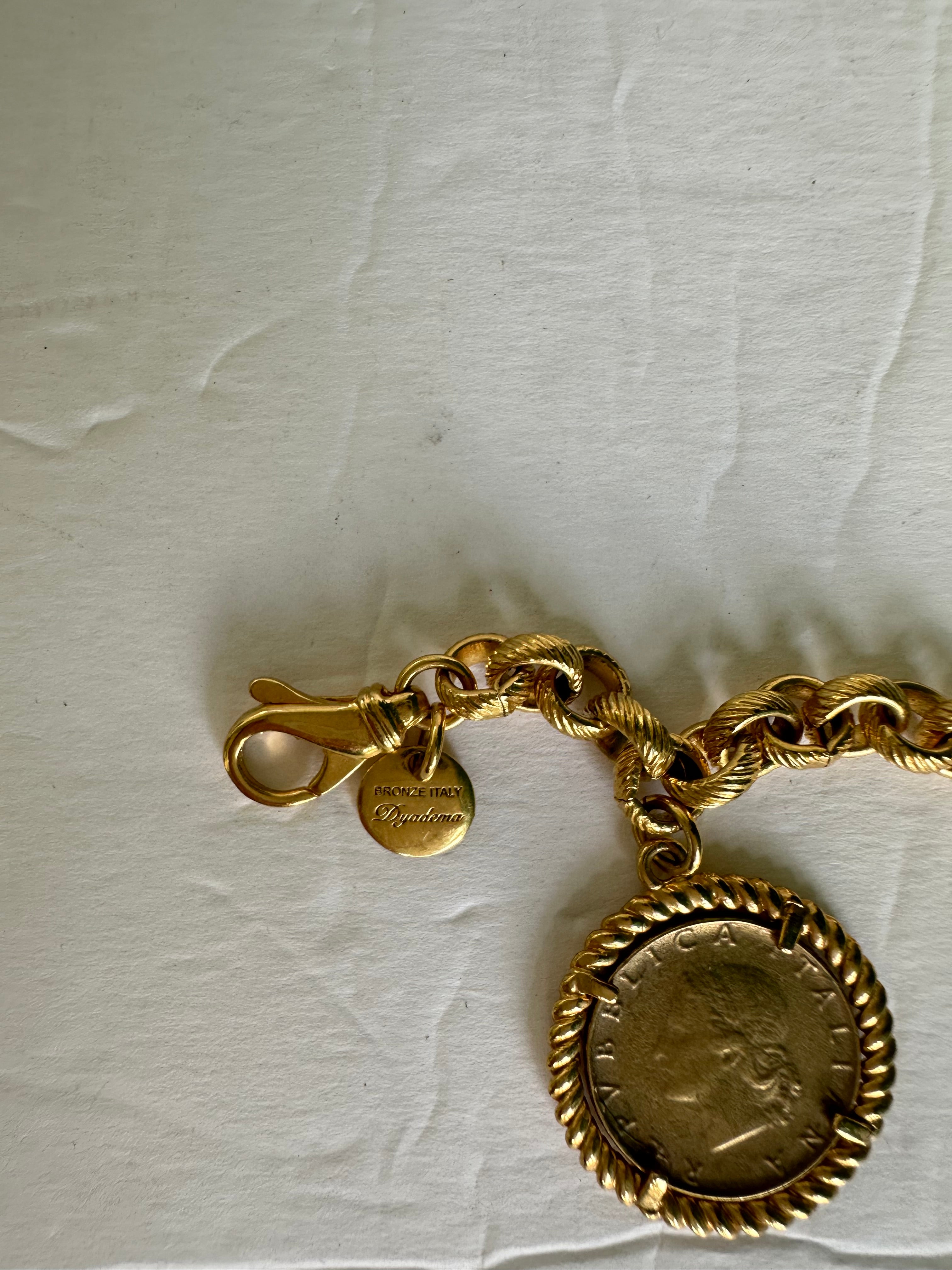 Vintage Dyadema Italy signed gold chain link with coin dangle/charm bracelet.