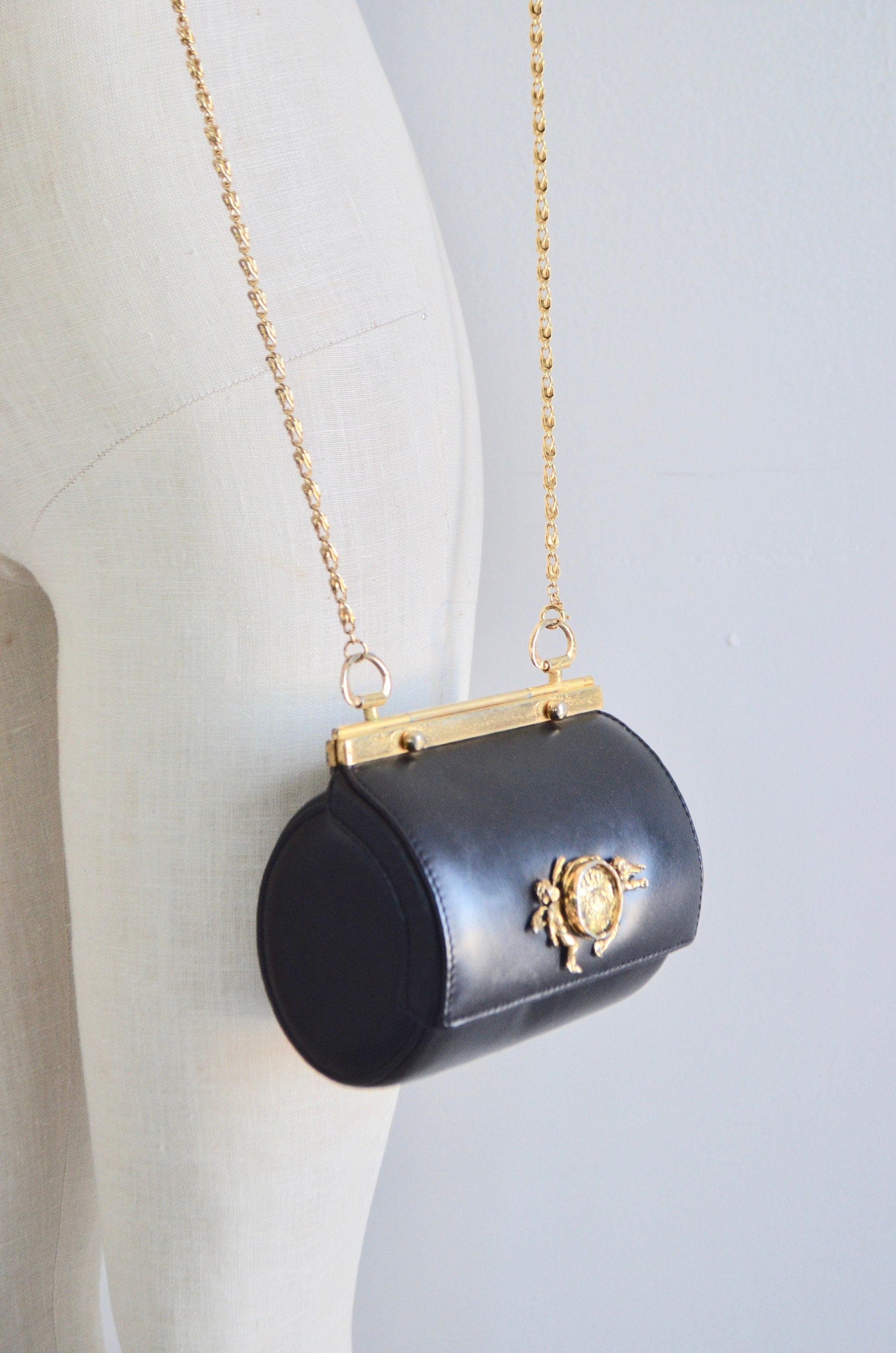 Round Circle Black Leather Hard Mini Crossbody Bag Gold Cupid Cherub Medallion Hardware Handbag